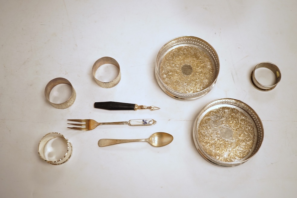 Two George V engine turned silver cigarette cases, largest 12.6cm, together with a pair of Asprey & Co silver ashtrays, a small silver dish, a silver condiment, six silver napkin rings, seven plated items and a quantity